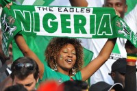 Nigerians fan hold aloft the Naija banner